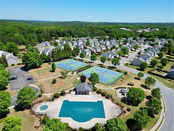 an aerial view of residential houses with outdoor space