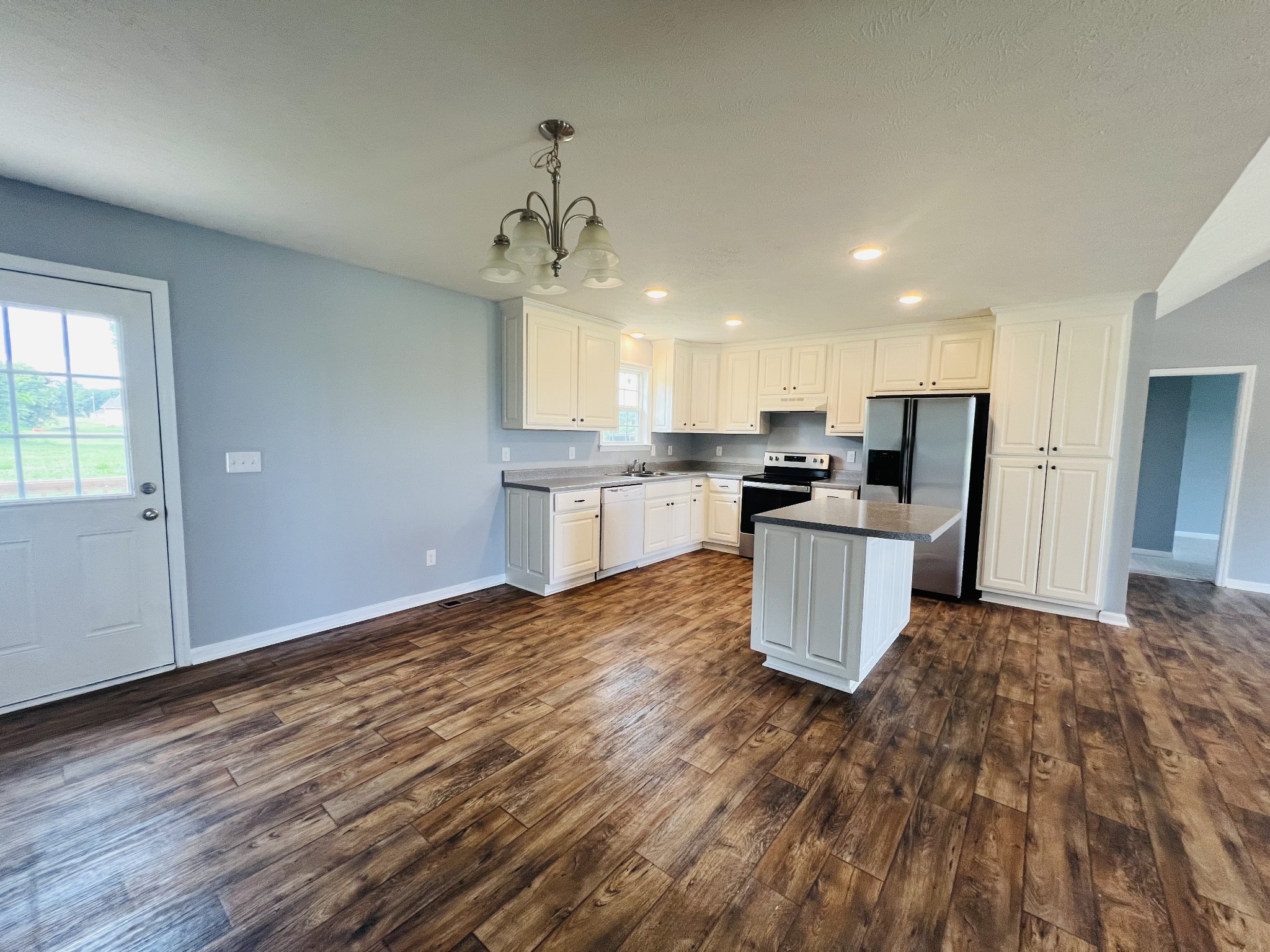 4560 Fall River Road Pulaski, TN 38478 - Photo 9 of 28 a kitchen with stainless steel appliances granite countertop a sink and cabinets