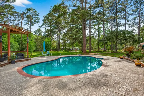 a view of a swimming pool with a patio