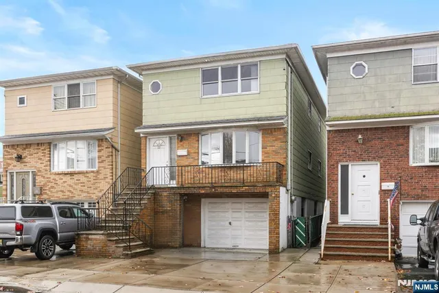 a front view of a house with a garage