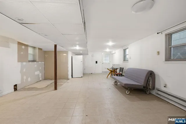 a view of a livingroom with furniture and a ceiling fan