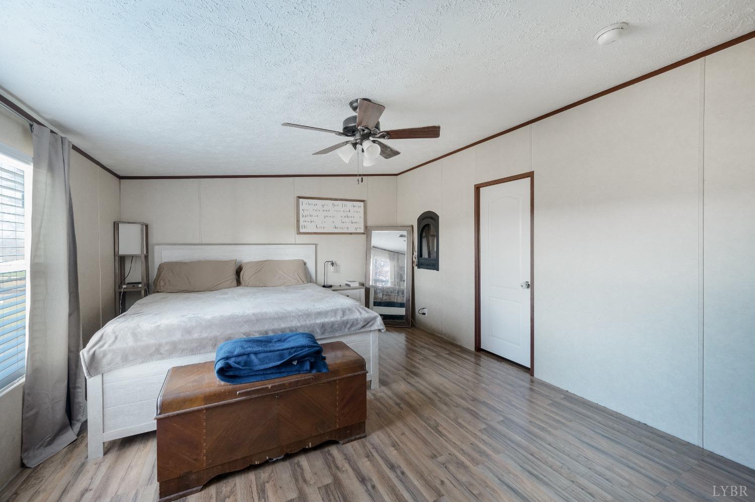 276 Beeks Lane Spout Spring, VA 24593 - Photo 11 of 29 a bedroom with a bed and window