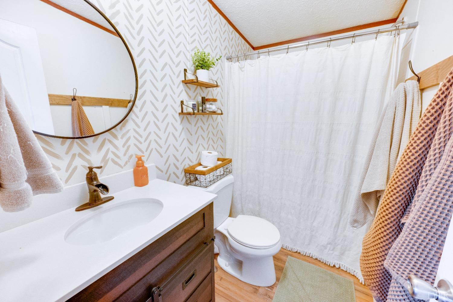 276 Beeks Lane Spout Spring, VA 24593 - Photo 15 of 29 a bathroom with a sink and a mirror