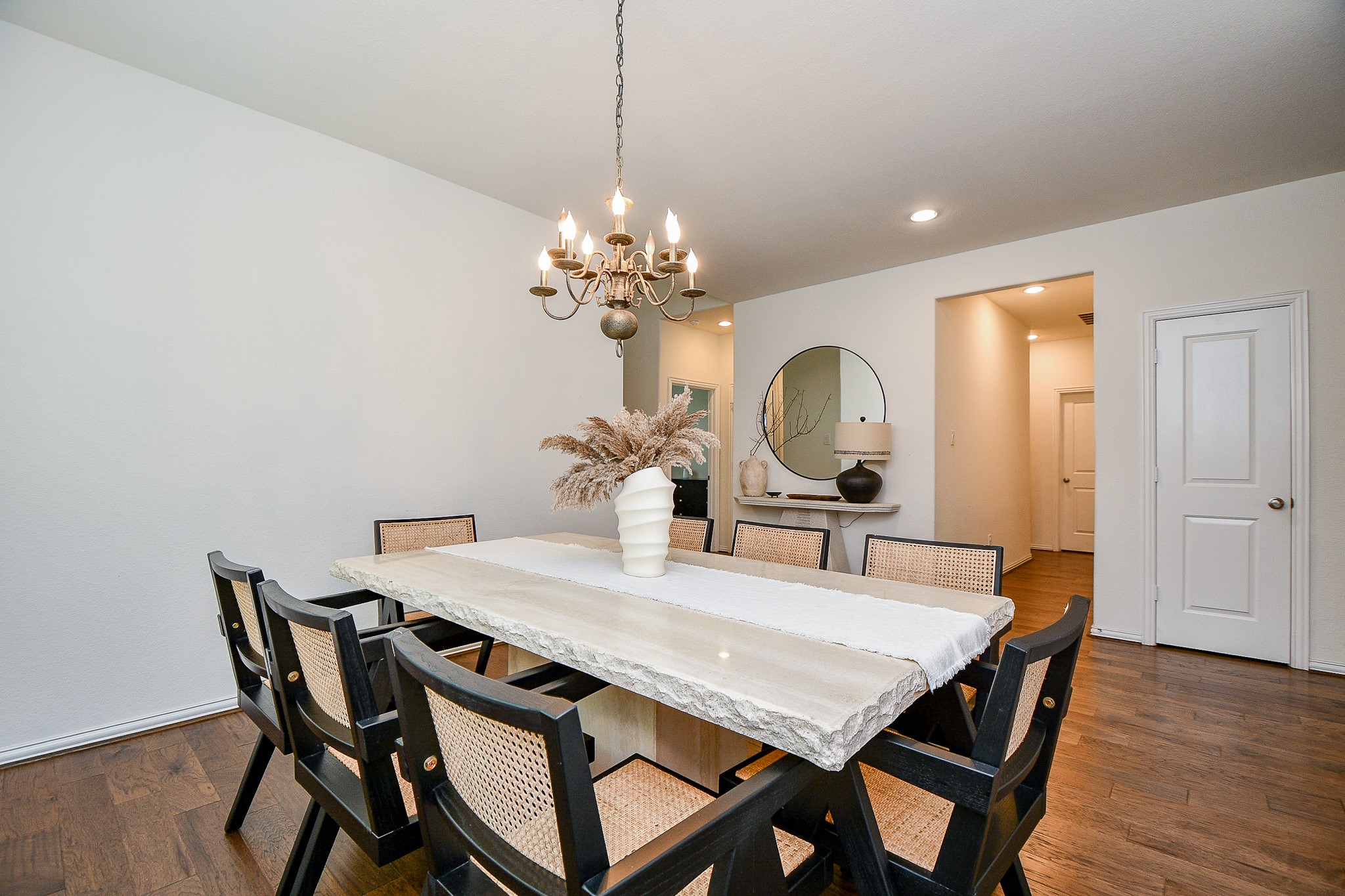 4523 Juniper Ridge Lane Manvel, TX 77578 - Photo 10 of 38 a view of a dining room with furniture and wooden floor