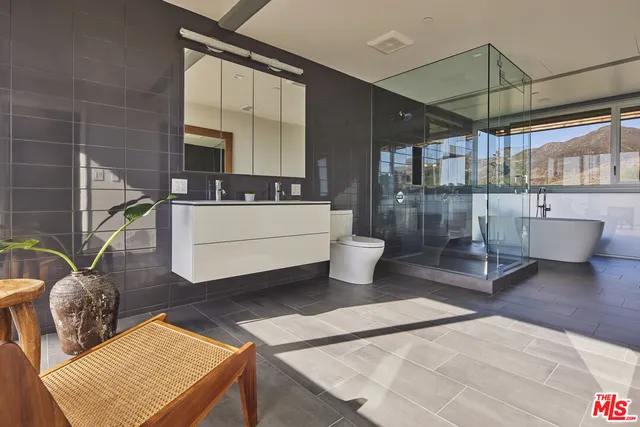a view of a terrace with couches and wooden floor