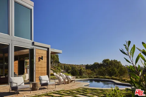 a view of multiple houses with a street