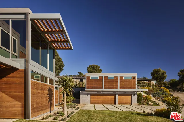 a bedroom with a bed and a potted plant