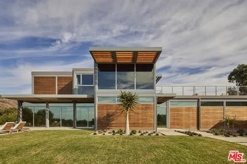 front view of a house with a swimming pool