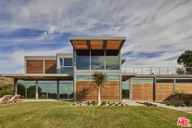 front view of a house with a swimming pool