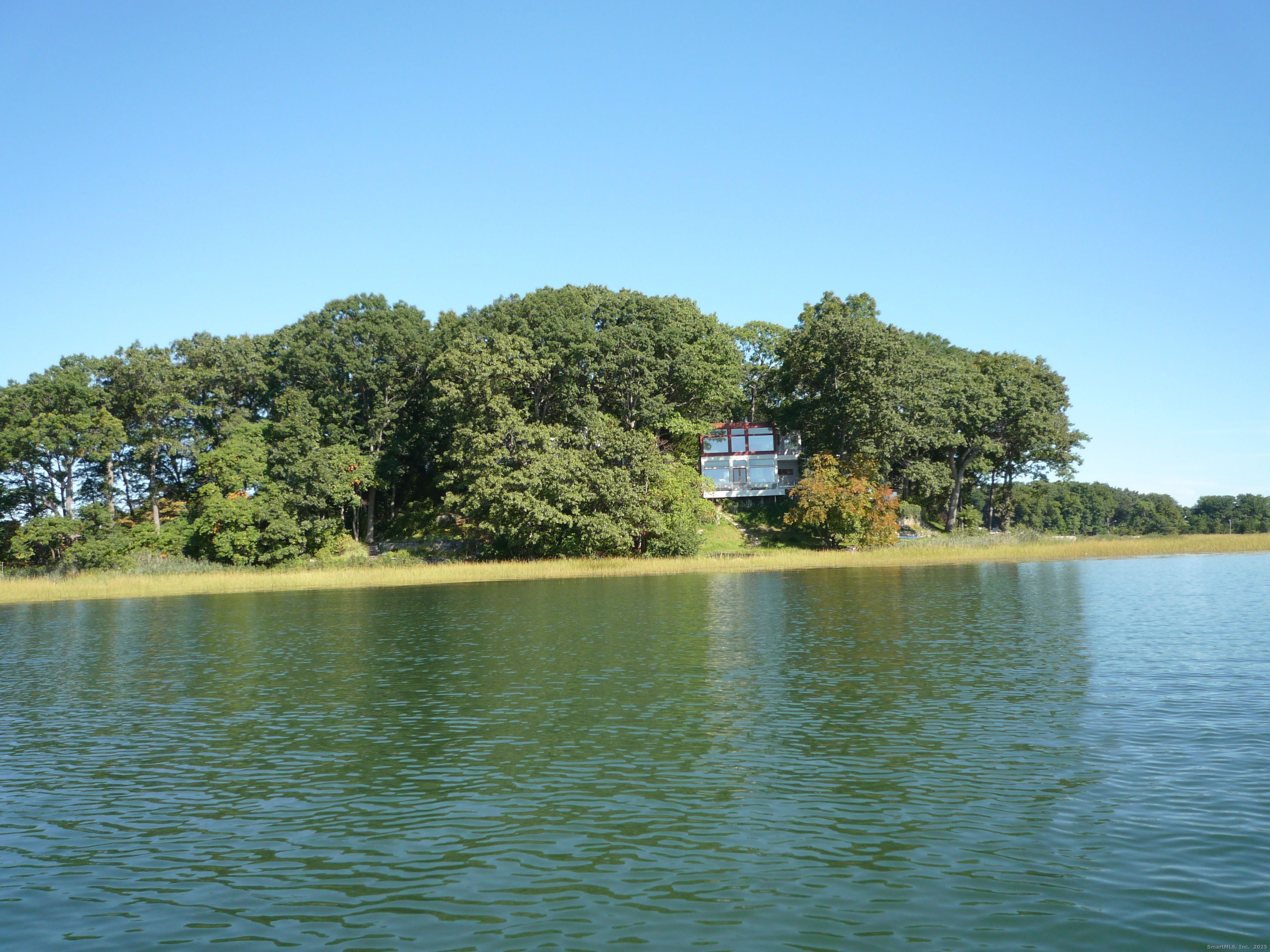 5 Outer Road Norwalk, CT 06854 - Photo 9 of 11 a view of an ocean with a mountain in the background