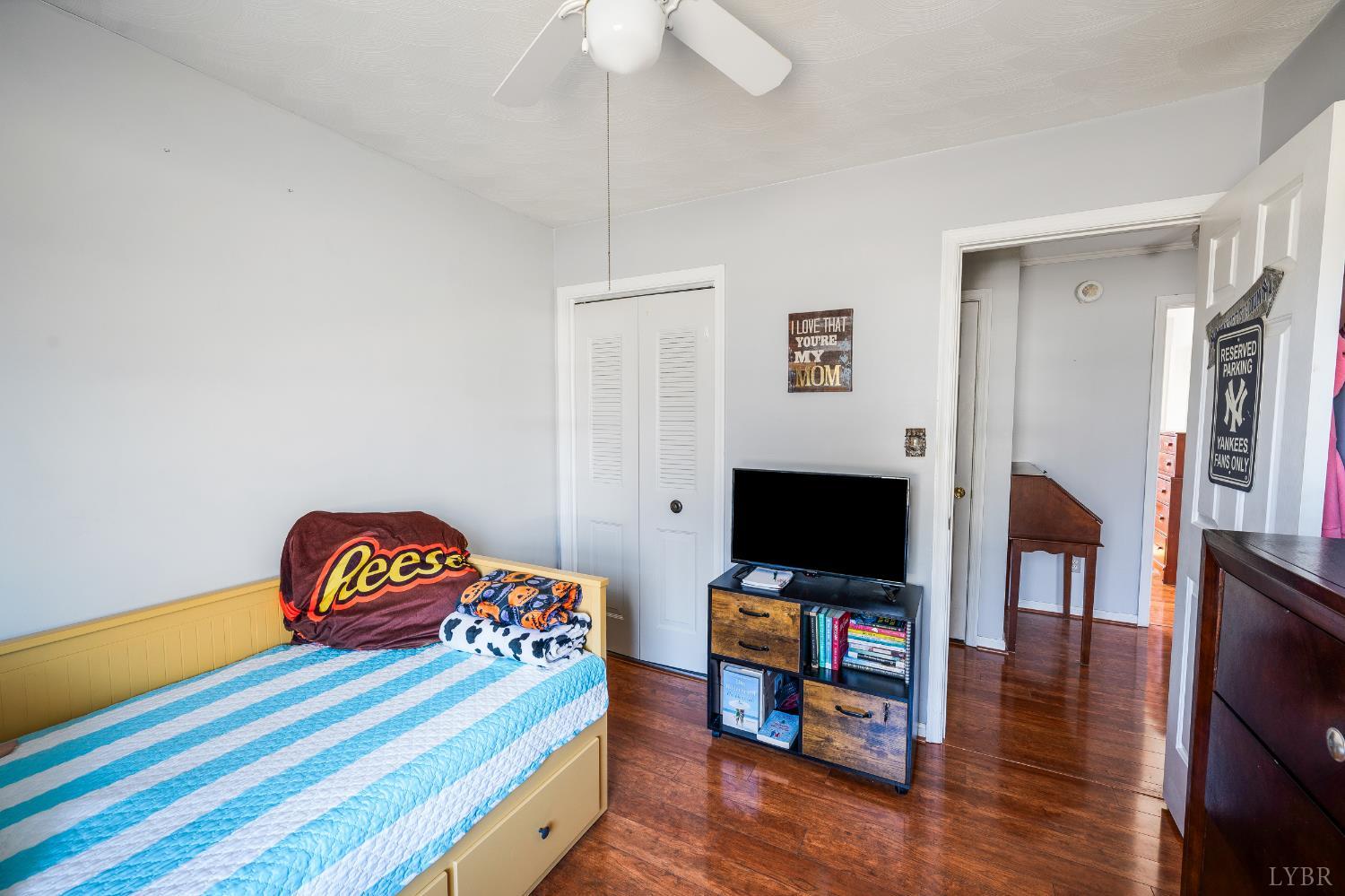 2550 Town Fork Road Evington, VA 24550 - Photo 17 of 42 a living room with a bed and a flat screen tv