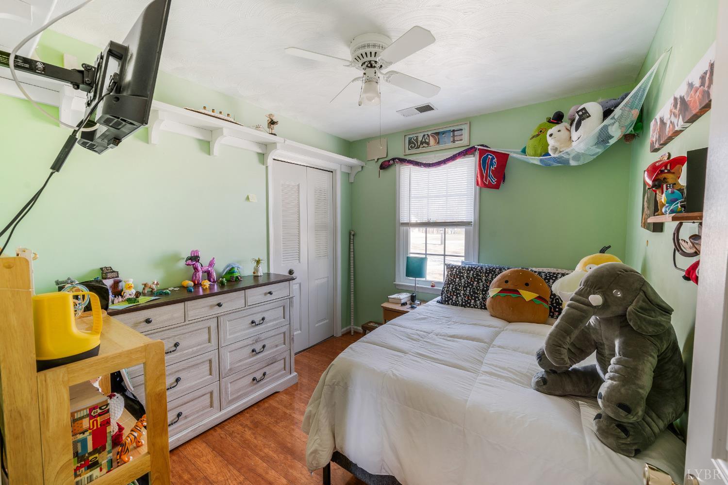 2550 Town Fork Road Evington, VA 24550 - Photo 18 of 42 a bedroom with a bed and wooden floor