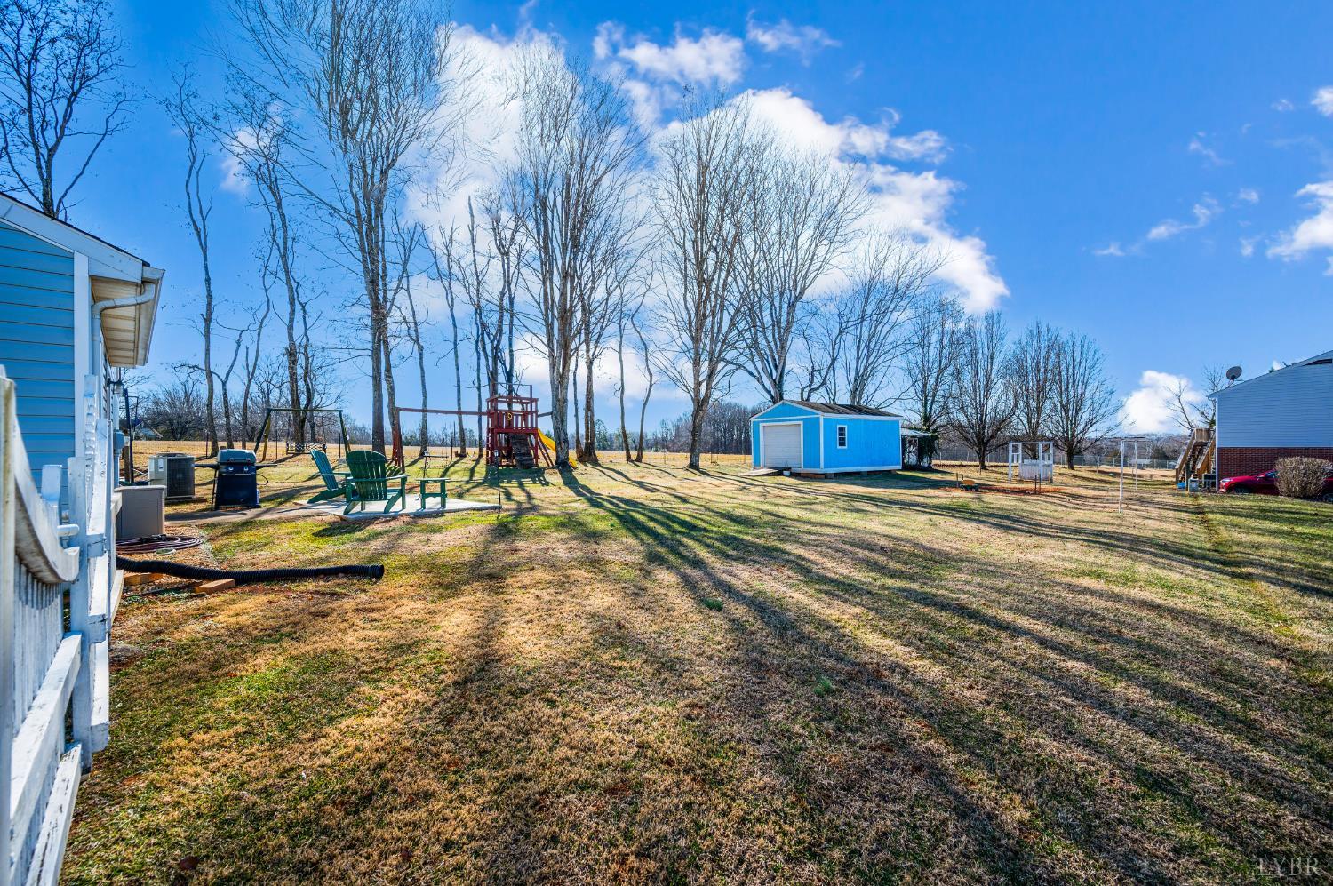 2550 Town Fork Road Evington, VA 24550 - Photo 19 of 42 a view of swimming pool with outdoor seating and trees