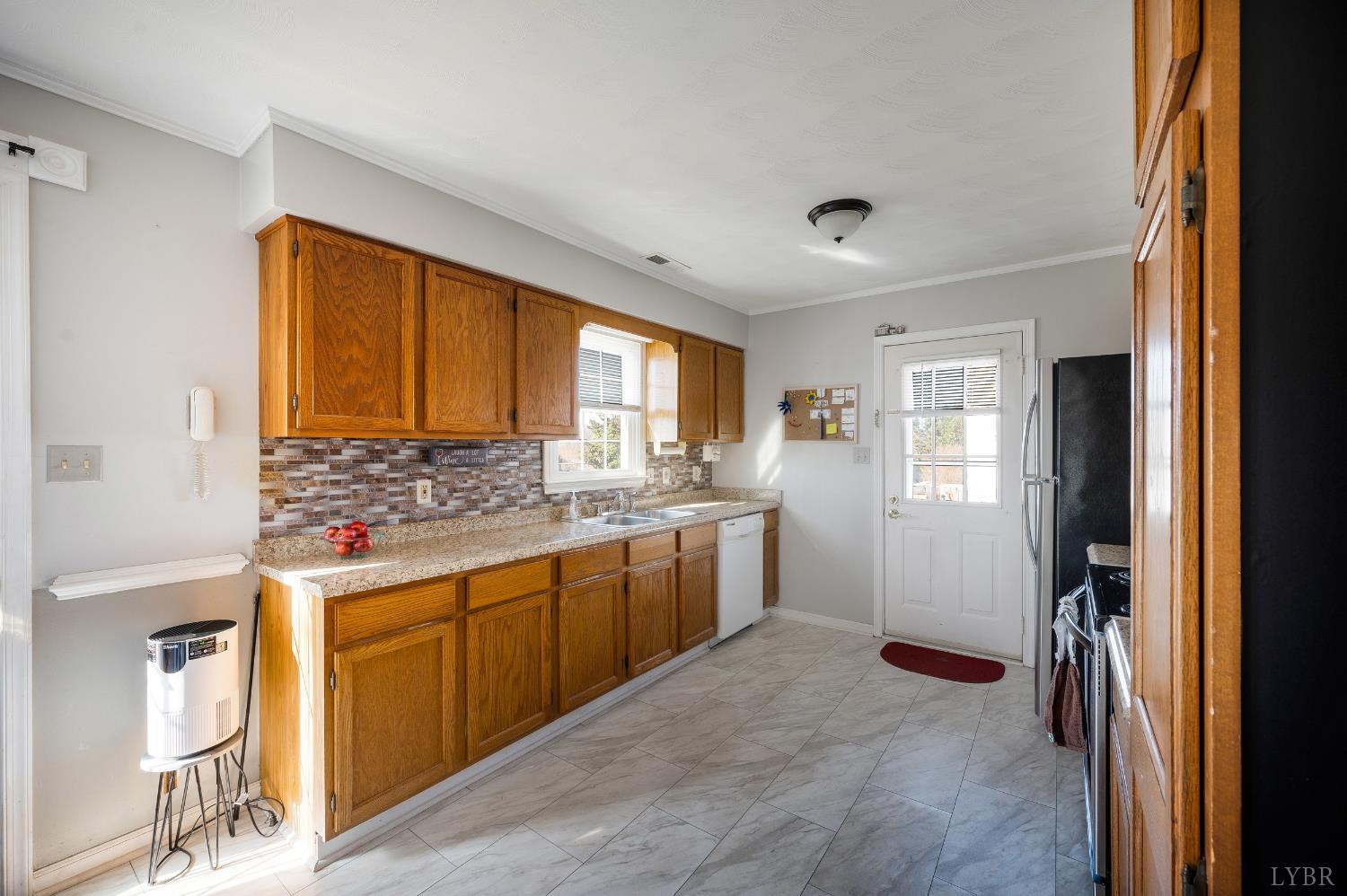 2550 Town Fork Road Evington, VA 24550 - Photo 38 of 42 a kitchen with a stove a refrigerator and a sink