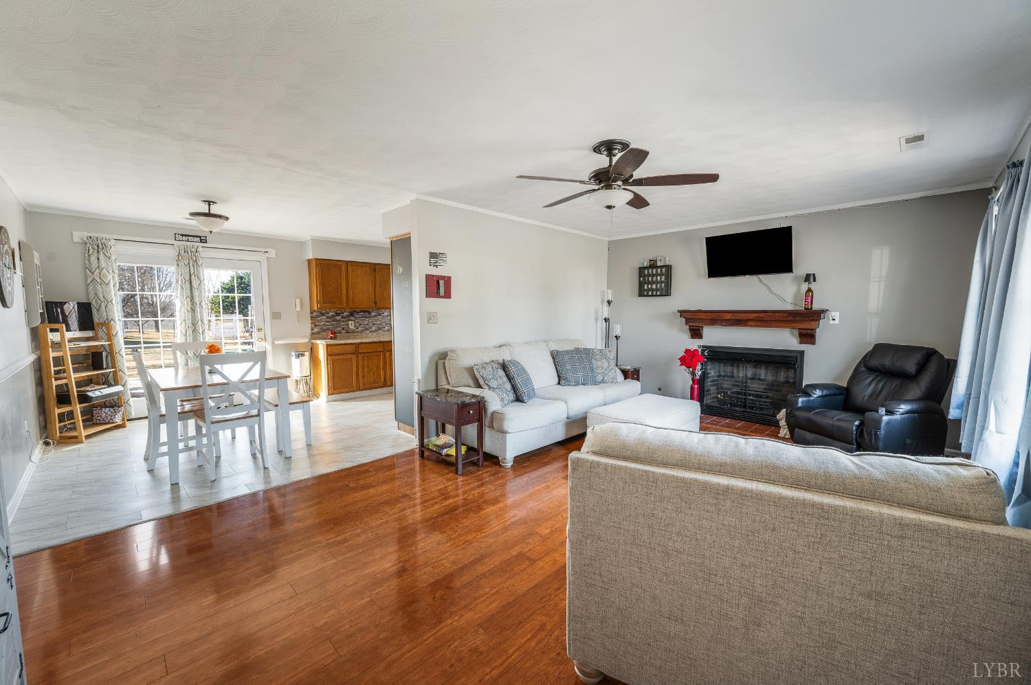 2550 Town Fork Road Evington, VA 24550 - Photo 5 of 42 a living room with furniture a flat screen tv and kitchen view