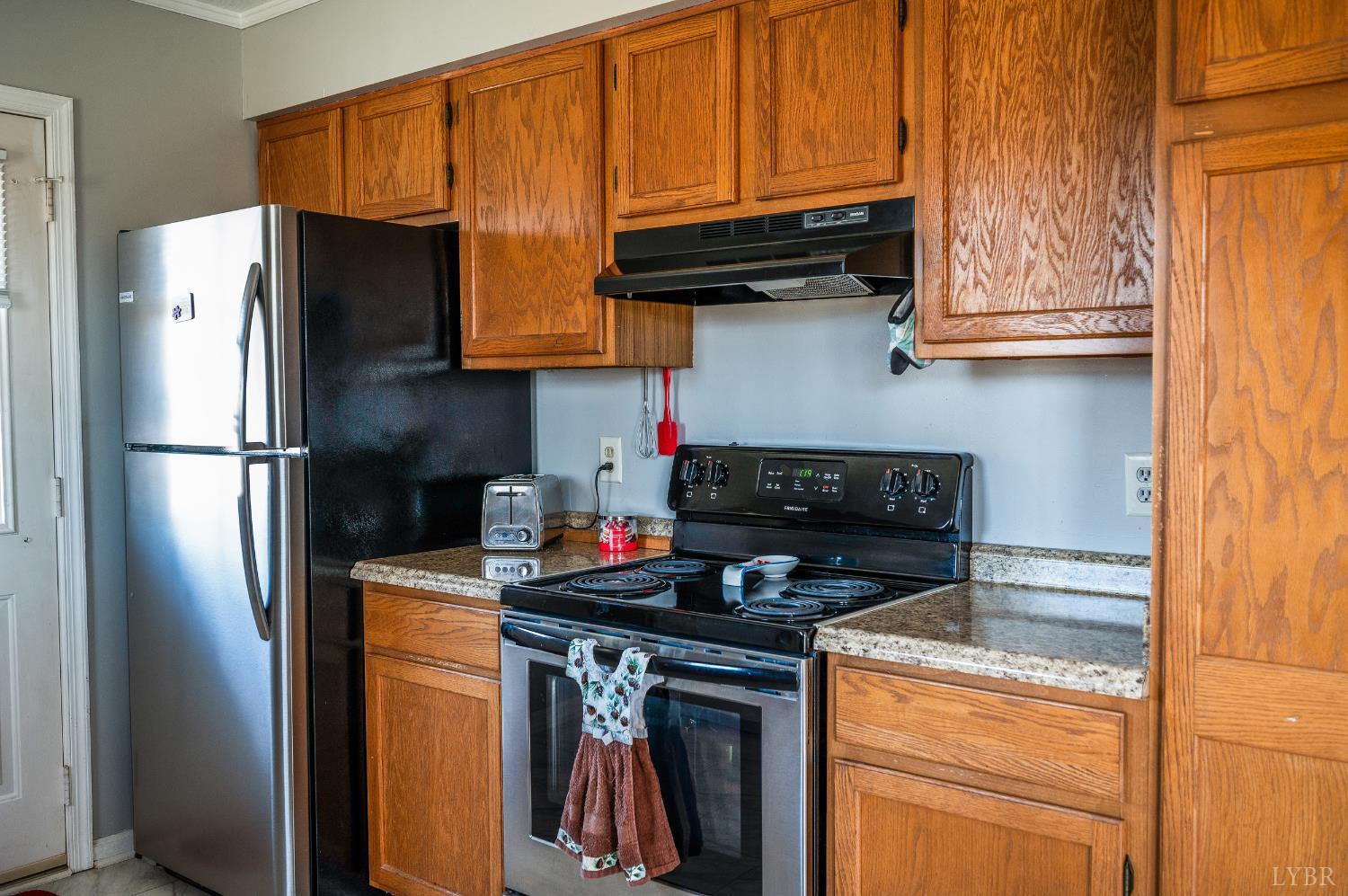 2550 Town Fork Road Evington, VA 24550 - Photo 9 of 42 a kitchen with stainless steel appliances granite countertop a refrigerator stove and sink