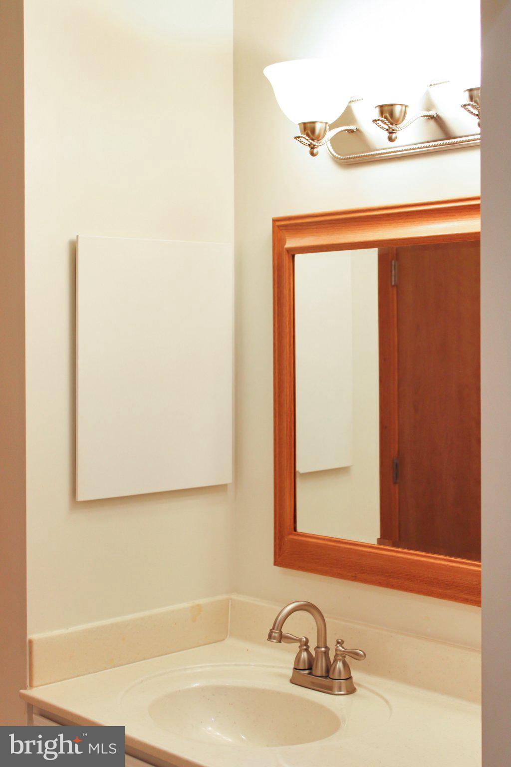 522 Unity Place Buckingham, VA 23921 - Photo 17 of 21 a bathroom with a sink and a mirror