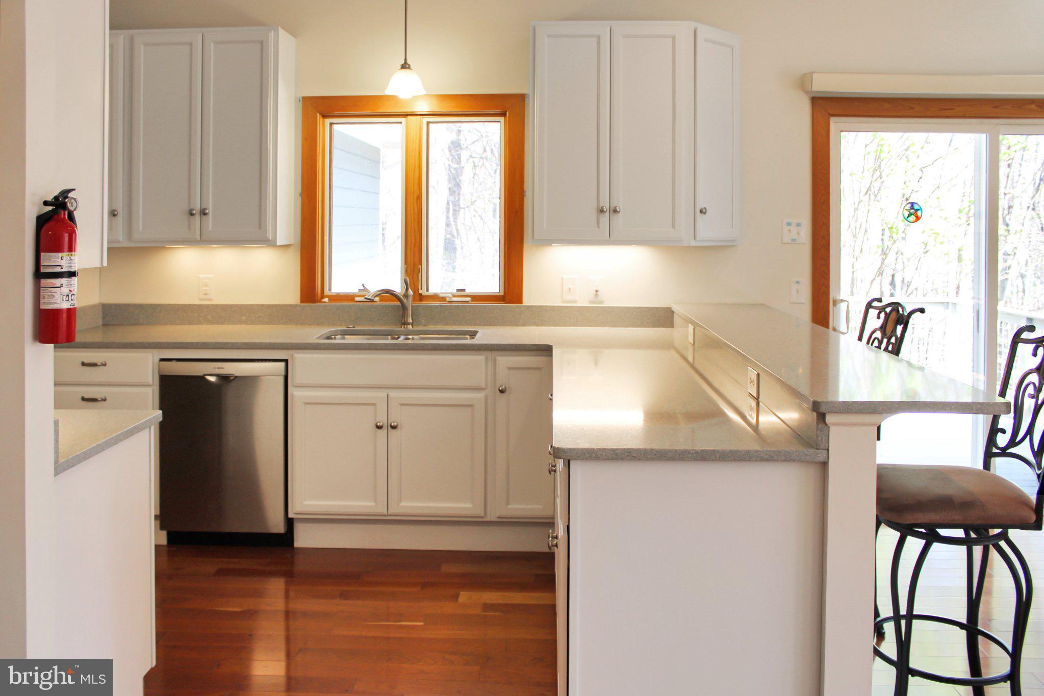 522 Unity Place Buckingham, VA 23921 - Photo 4 of 21 a kitchen with stainless steel appliances granite countertop a stove a sink and a microwave