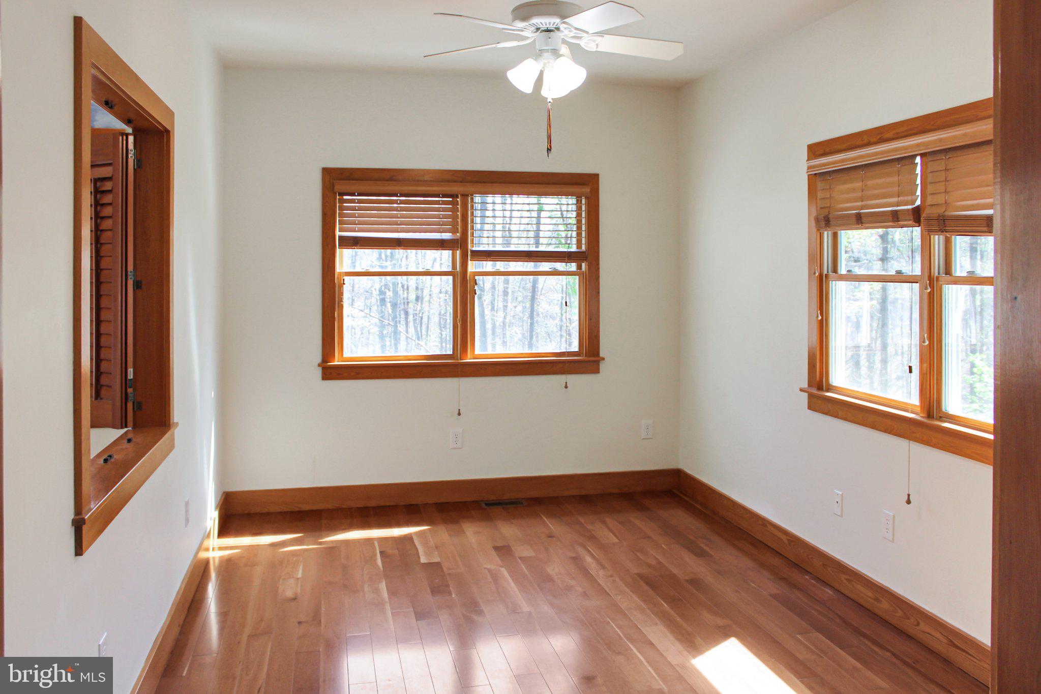 522 Unity Place Buckingham, VA 23921 - Photo 6 of 21 a view of an empty room with wooden floor and a window