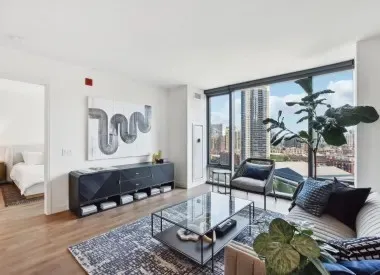 a living room with furniture and a large window