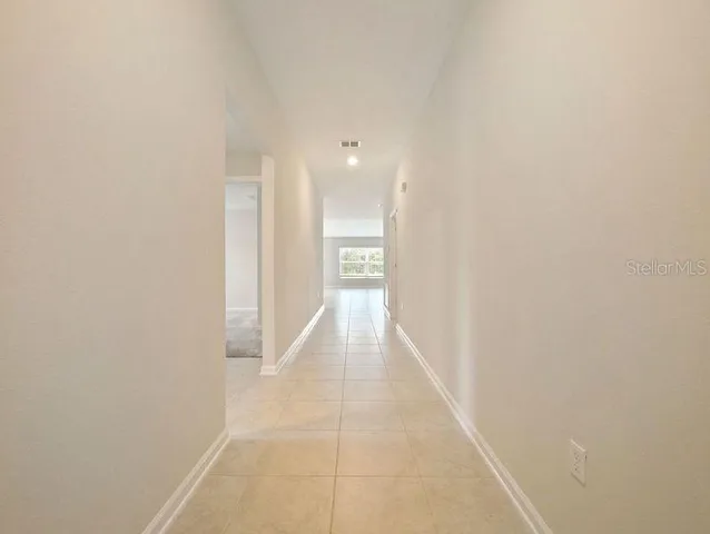 a bathroom with a sink a toilet a mirror and shower