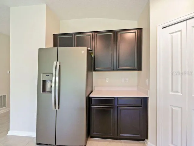 a refrigerator freezer sitting in a kitchen