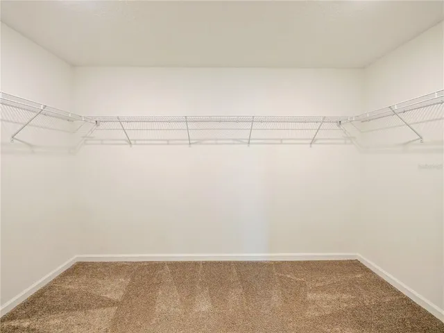 a view of a room with racks on the wall