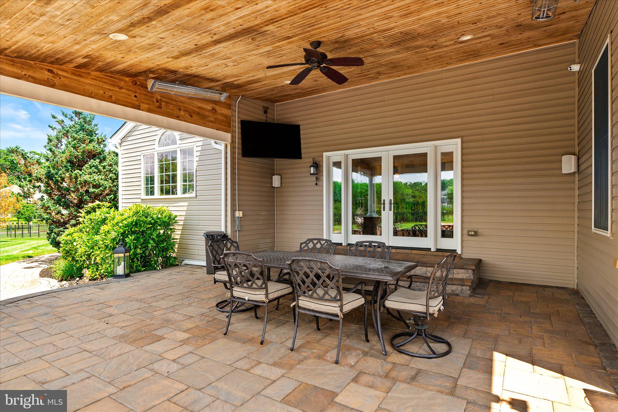 25 Weathervane Circle Cream Ridge, NJ 08514 - Photo 60 of 91 a view of a patio with table and chairs and potted plants