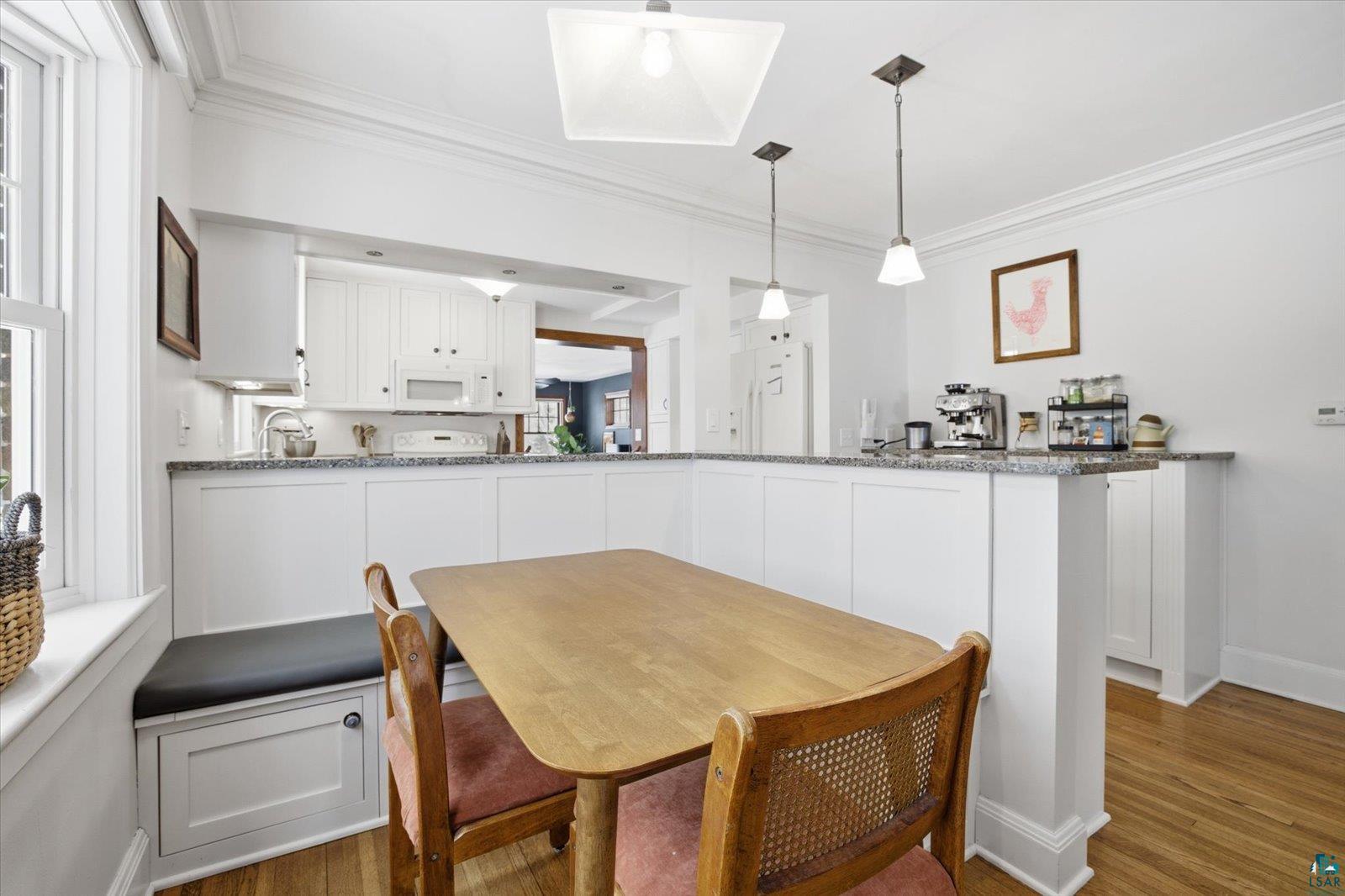 2201 Vermilion Road Duluth, MN 55803 - Photo 12 of 79 Dining room featuring light wood-style floors, ornamental molding, and healthy amount of natural light