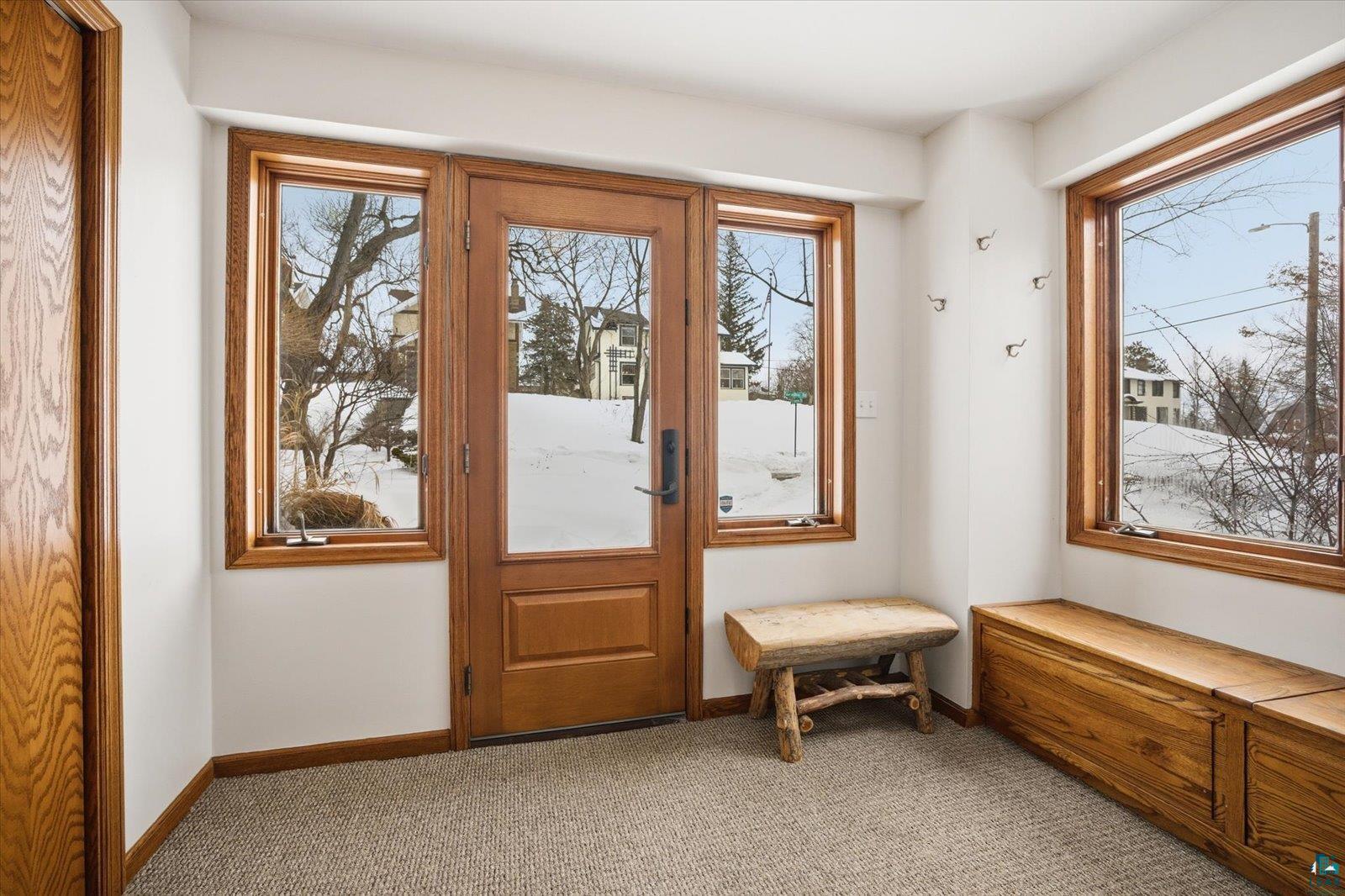 2201 Vermilion Road Duluth, MN 55803 - Photo 3 of 79 Doorway featuring carpet flooring and healthy amount of natural light