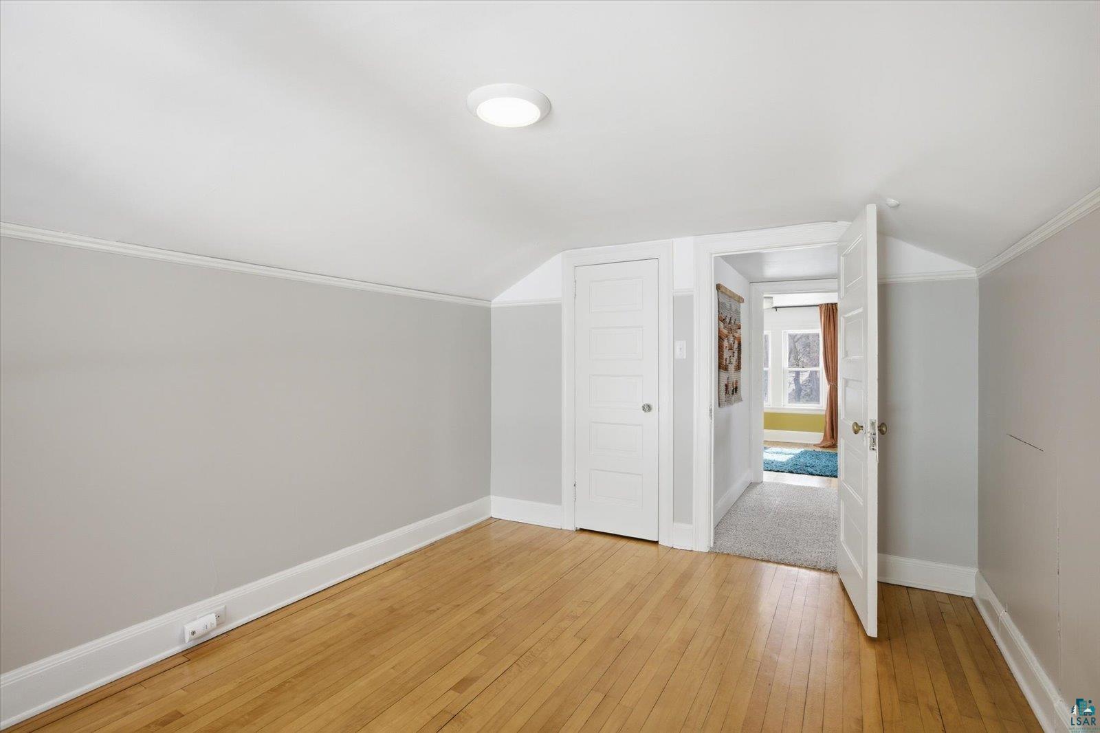 2201 Vermilion Road Duluth, MN 55803 - Photo 37 of 79 Additional living space with light wood-type flooring and lofted ceiling