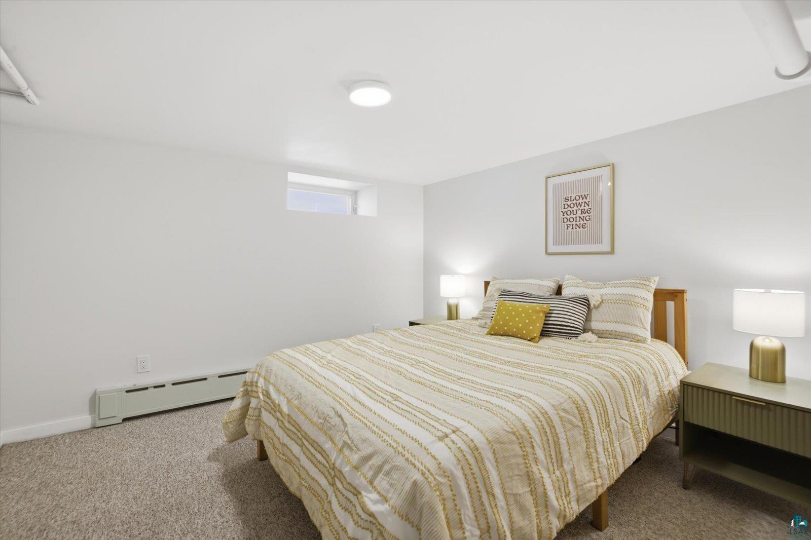 2201 Vermilion Road Duluth, MN 55803 - Photo 43 of 79 Carpeted bedroom with a baseboard heating unit and baseboards