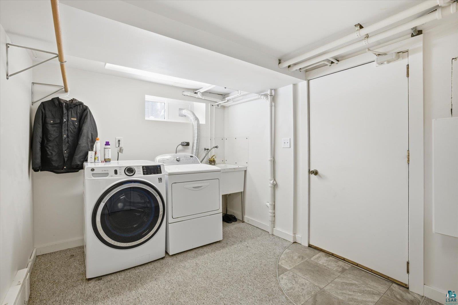 2201 Vermilion Road Duluth, MN 55803 - Photo 48 of 79 Laundry room with separate washer and dryer and light flooring