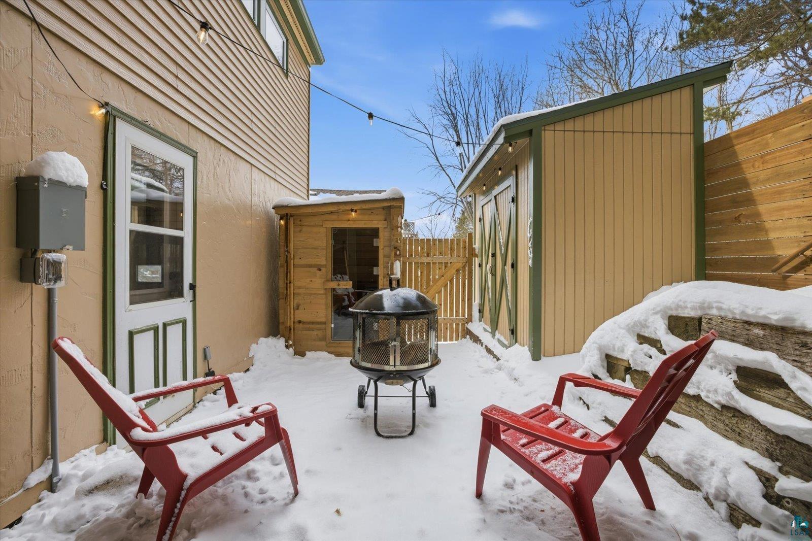 2201 Vermilion Road Duluth, MN 55803 - Photo 50 of 79 Snow covered patio with an outbuilding and a gate
