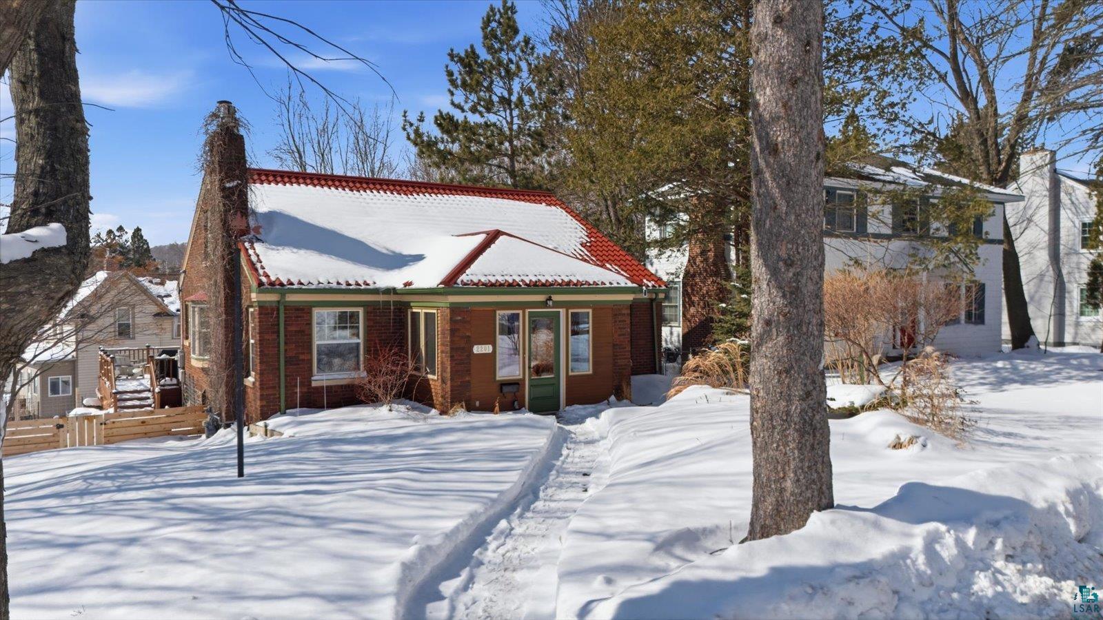 2201 Vermilion Road Duluth, MN 55803 - Photo 66 of 79 View of front of home with brick siding and a wooden deck