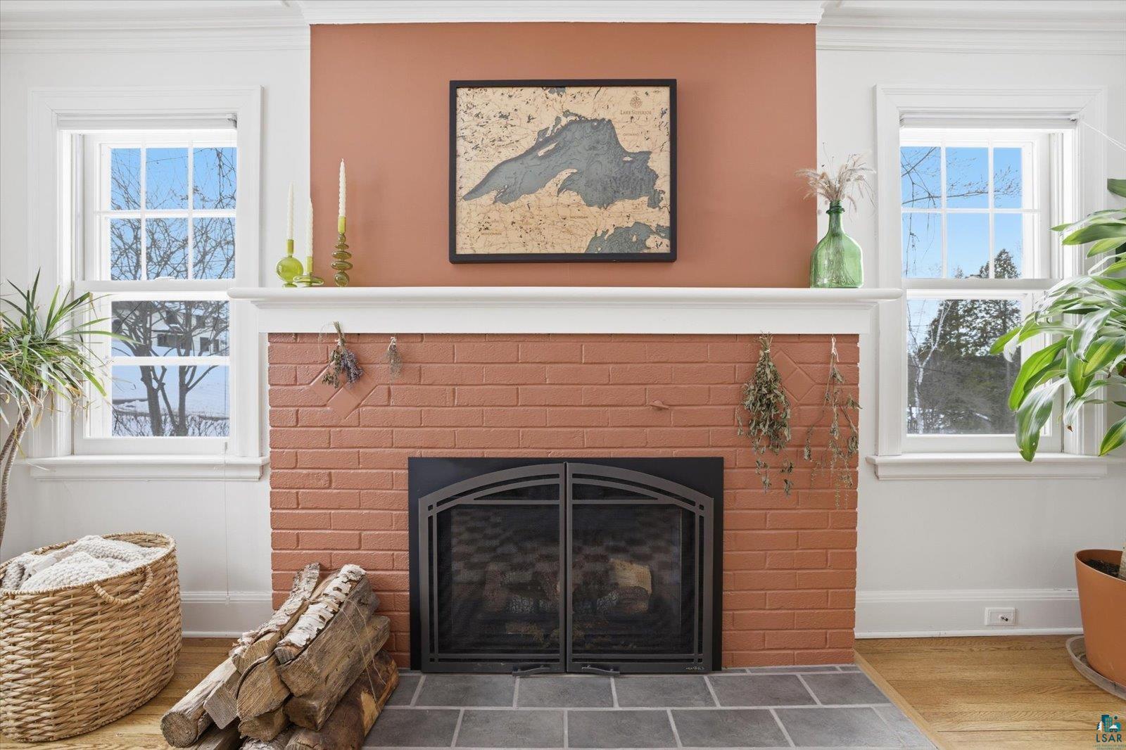 2201 Vermilion Road Duluth, MN 55803 - Photo 7 of 79 Detailed view of ornamental molding, wood finished floors, and a fireplace