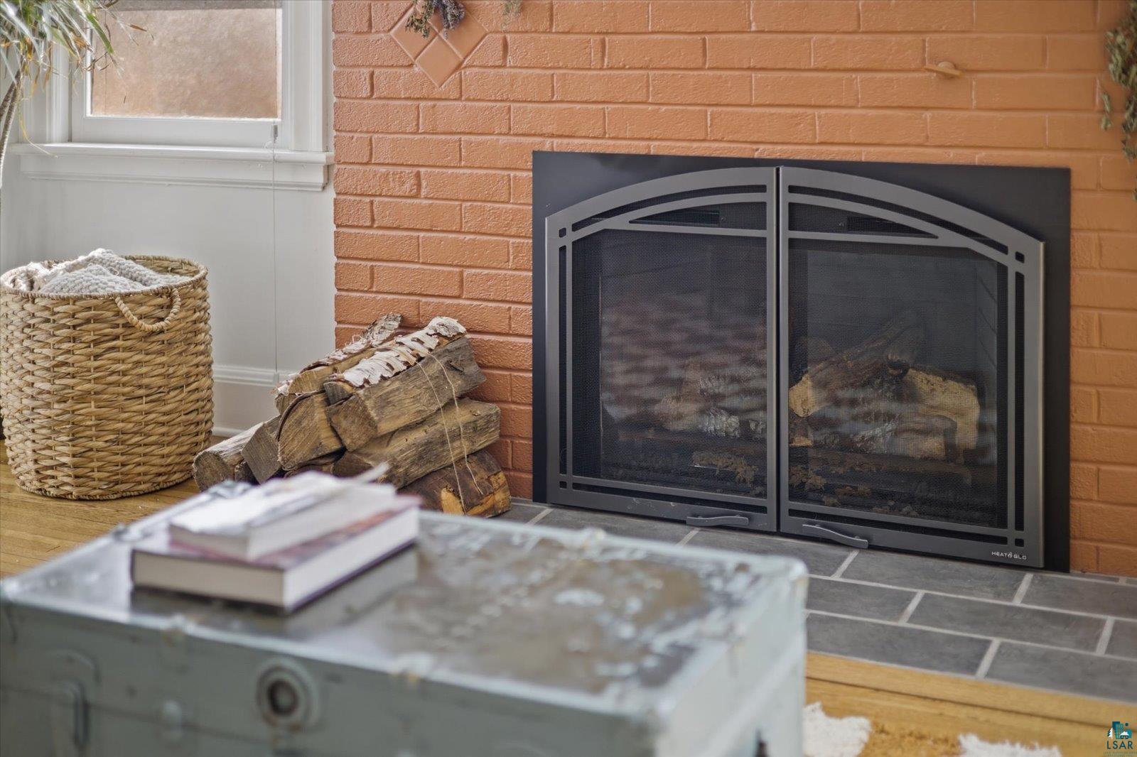 2201 Vermilion Road Duluth, MN 55803 - Photo 9 of 79 Detailed view of a glass covered fireplace and brick wall