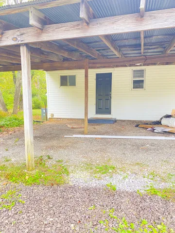 a view of a backyard of the house