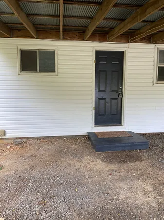 a view of a backyard of a house
