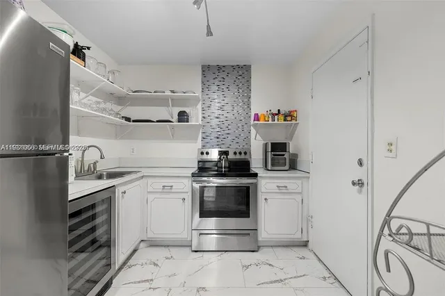 a kitchen with a stove and a sink
