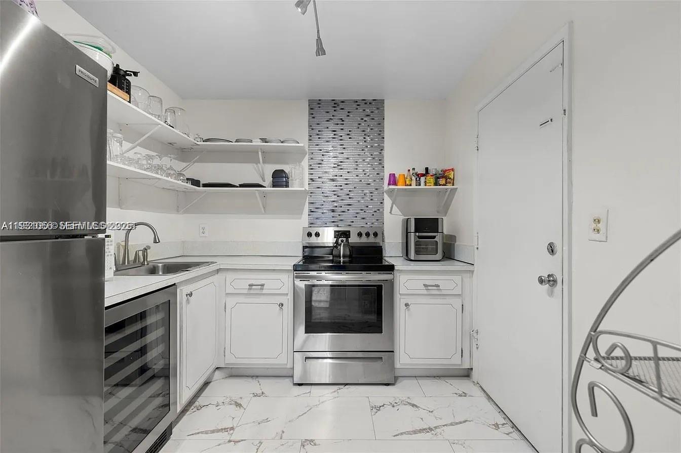 a kitchen with a stove and a sink