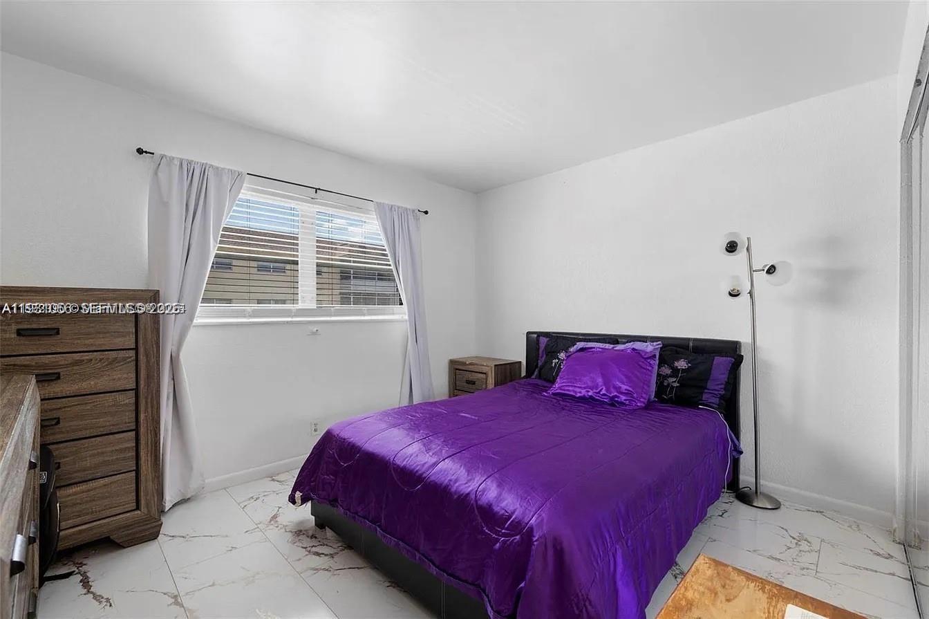 4043 Northwest 16th Street, Unit 201 Lauderhill, FL 33313 - Photo 16 of 22 a bedroom with a bed and a closet