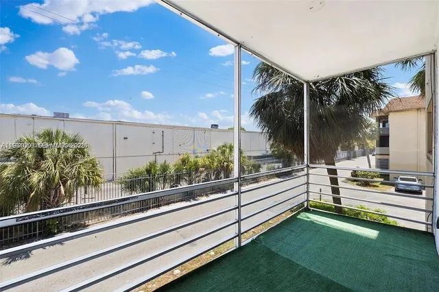 a view of a building and car parked