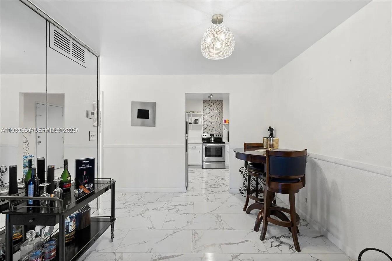 4043 Northwest 16th Street, Unit 201 Lauderhill, FL 33313 - Photo 4 of 22 a view of a dining room with furniture