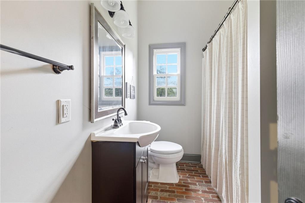 4337 Mountain View Road Oakwood, GA 30566 - Photo 53 of 84 a bathroom with a sink a toilet and shower