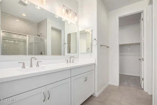a bathroom with a double vanity sink mirror and double
