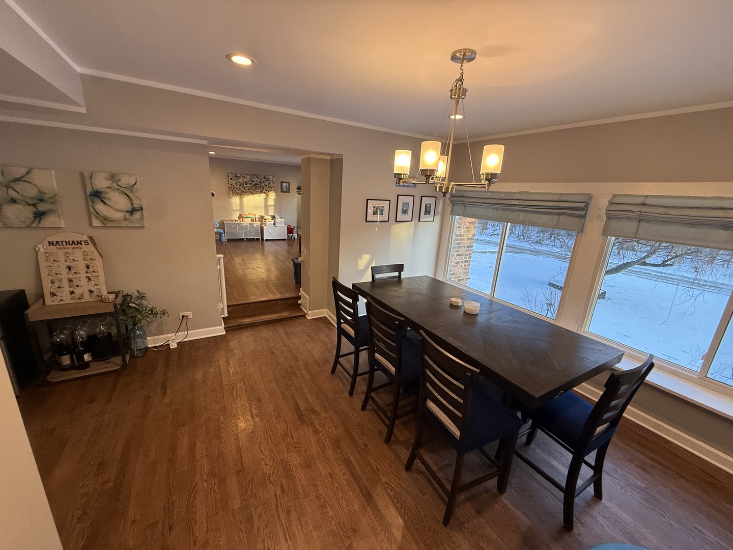1044 Ellsworth Avenue Addison, IL 60101 - Photo 13 of 45 a view of a dining room with furniture and wooden floor
