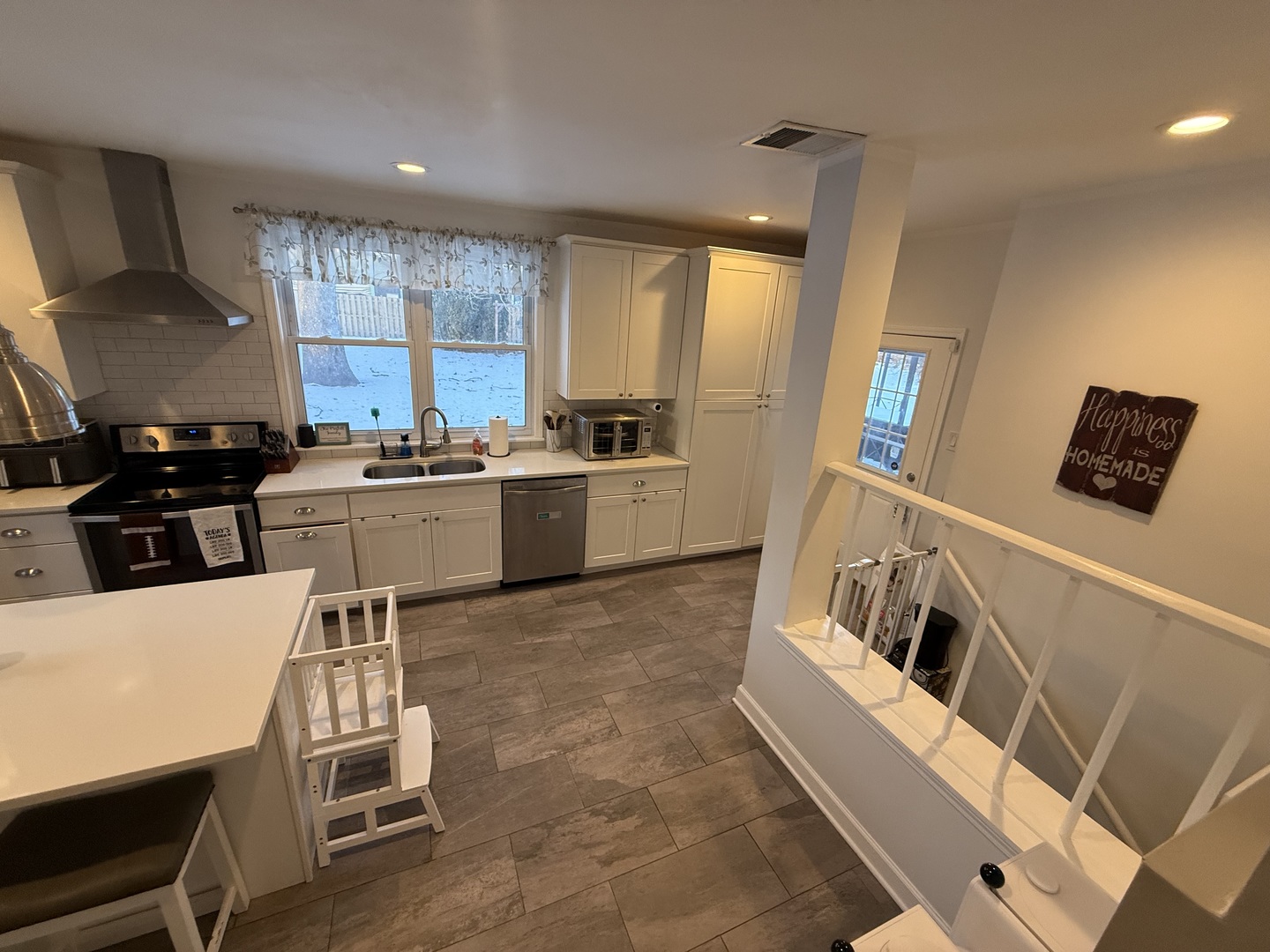 1044 Ellsworth Avenue Addison, IL 60101 - Photo 18 of 45 a kitchen with sink refrigerator and stove