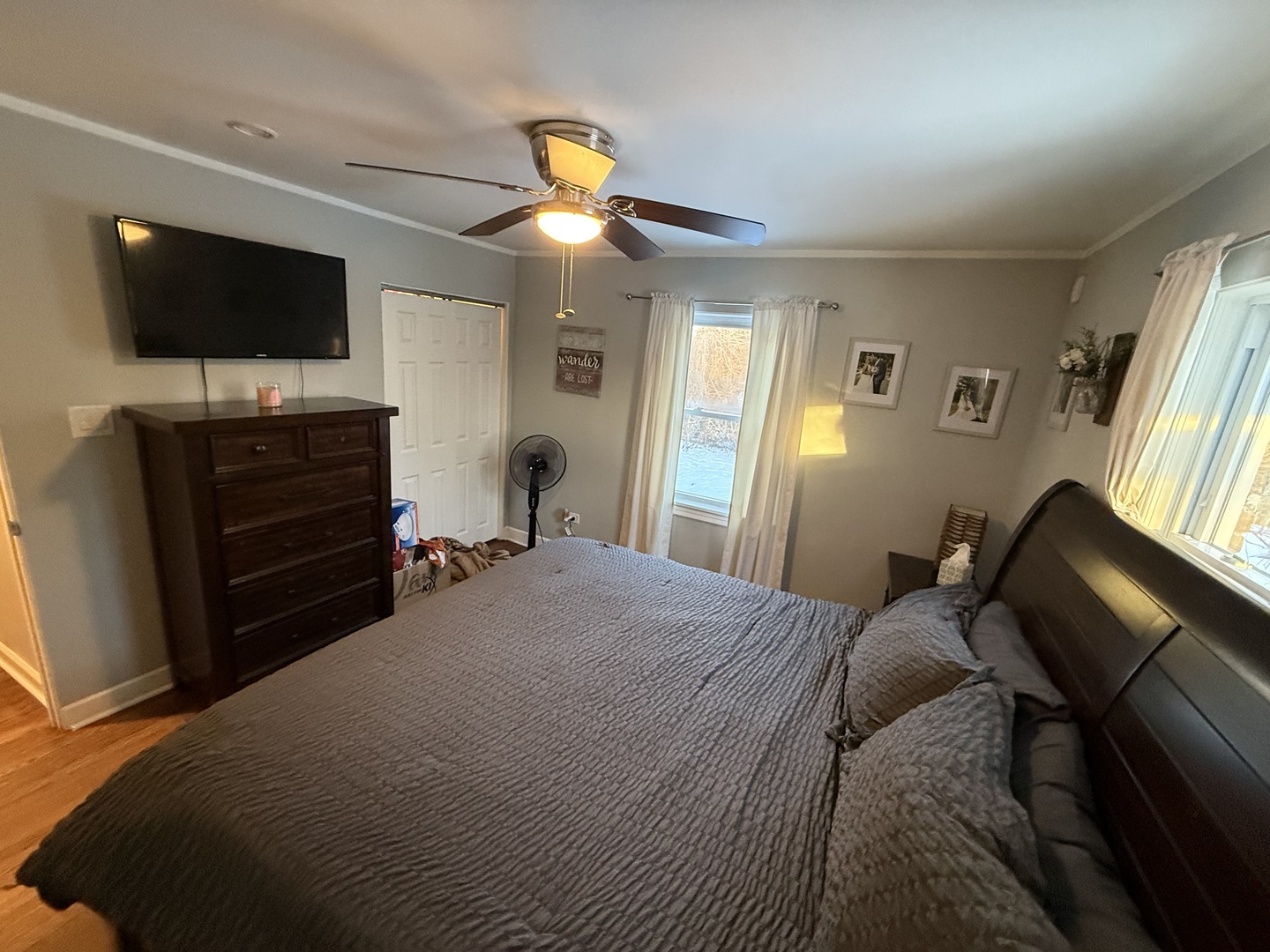 1044 Ellsworth Avenue Addison, IL 60101 - Photo 25 of 45 a bedroom with a bed and a flat tv screen on dresser