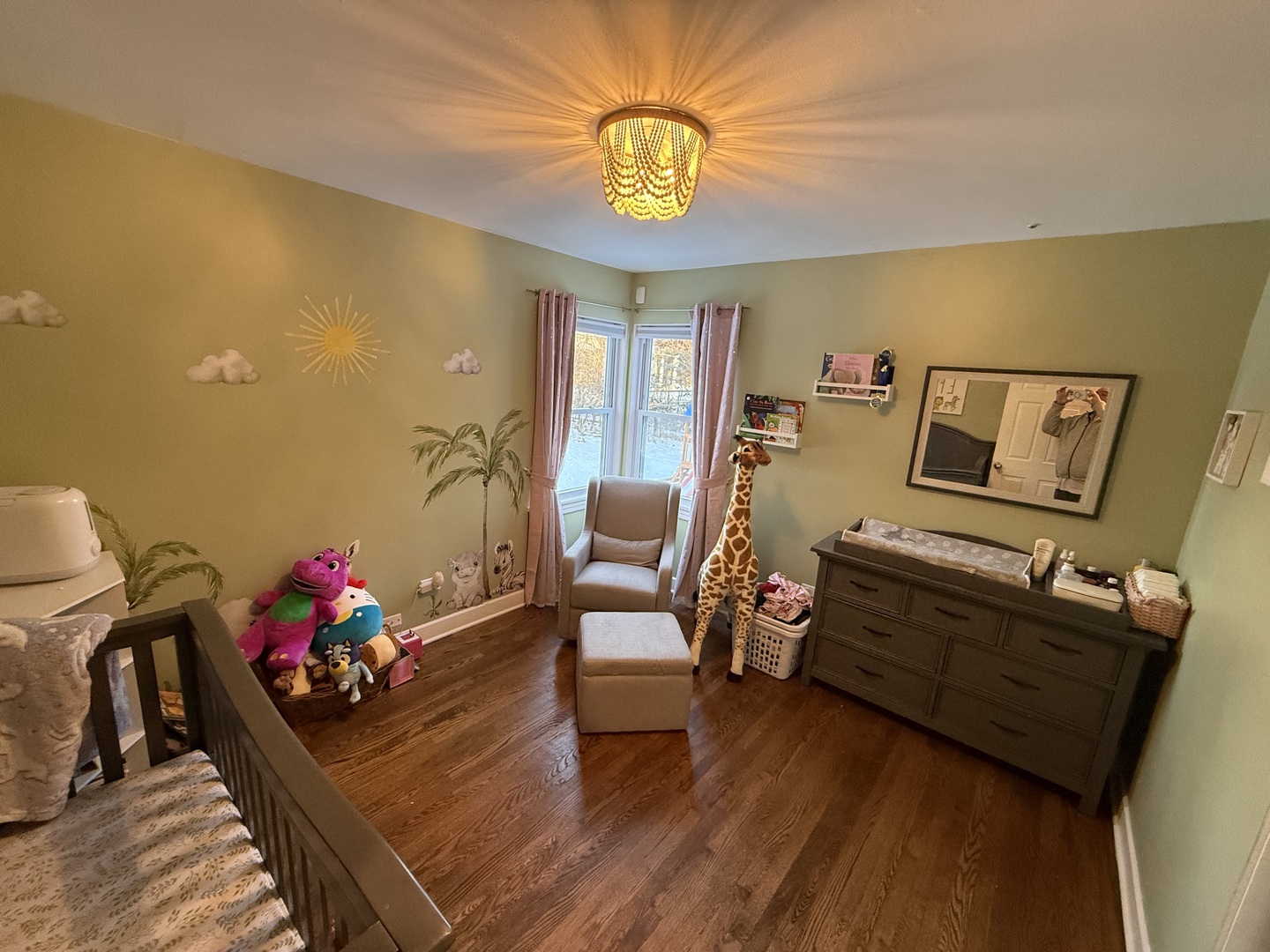 1044 Ellsworth Avenue Addison, IL 60101 - Photo 26 of 45 a living room with furniture and a chandelier